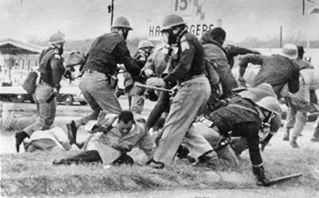 Civil rights marchers being beaten by Alabama State Troopers on the Edmund Pettus Bridge, Selma, 1965. This scene led to the passage of the Voting Rights Act later that year.